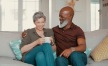 older couple relax on a couch